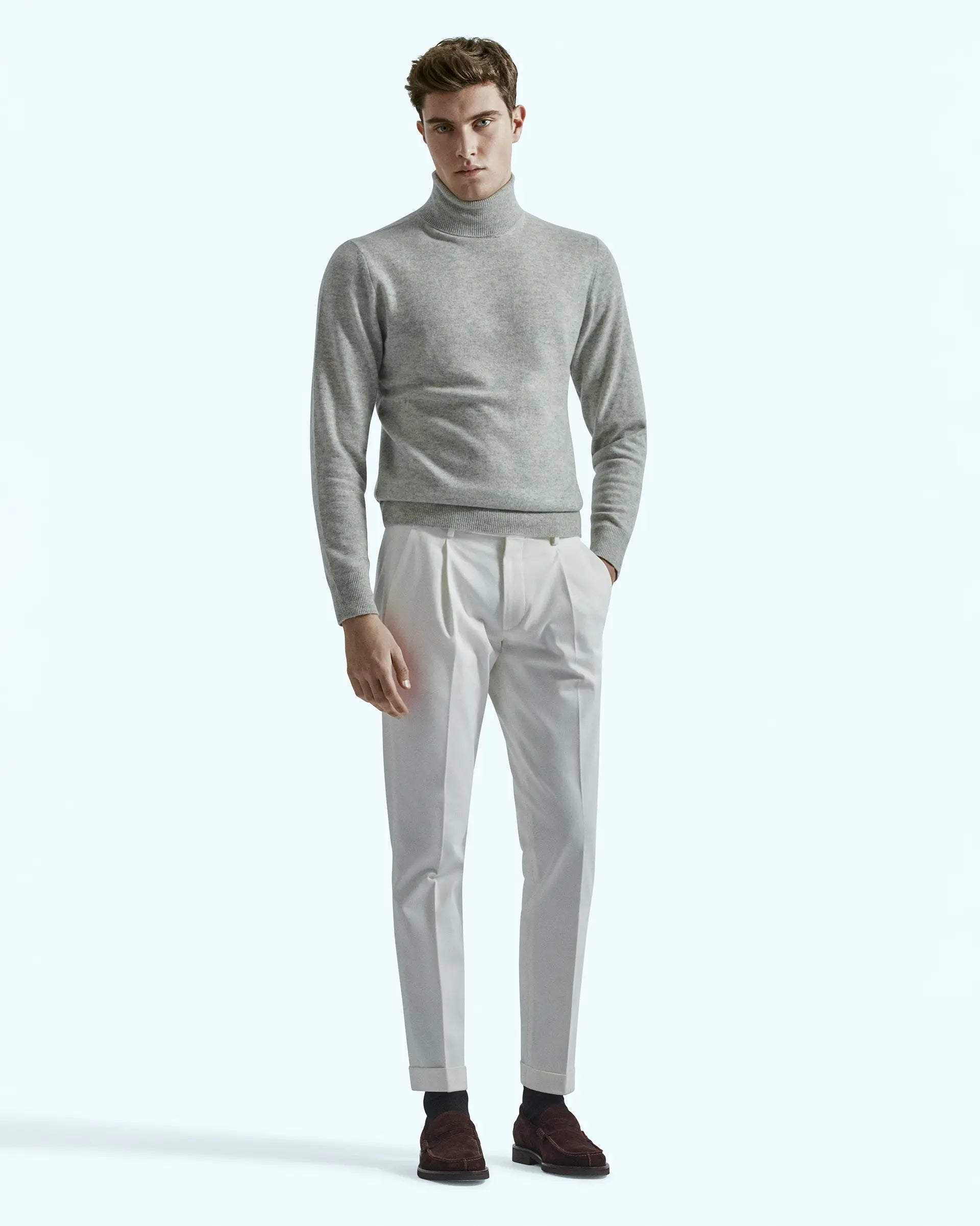 White trousers in stretch gabardine with pleats and side button placket