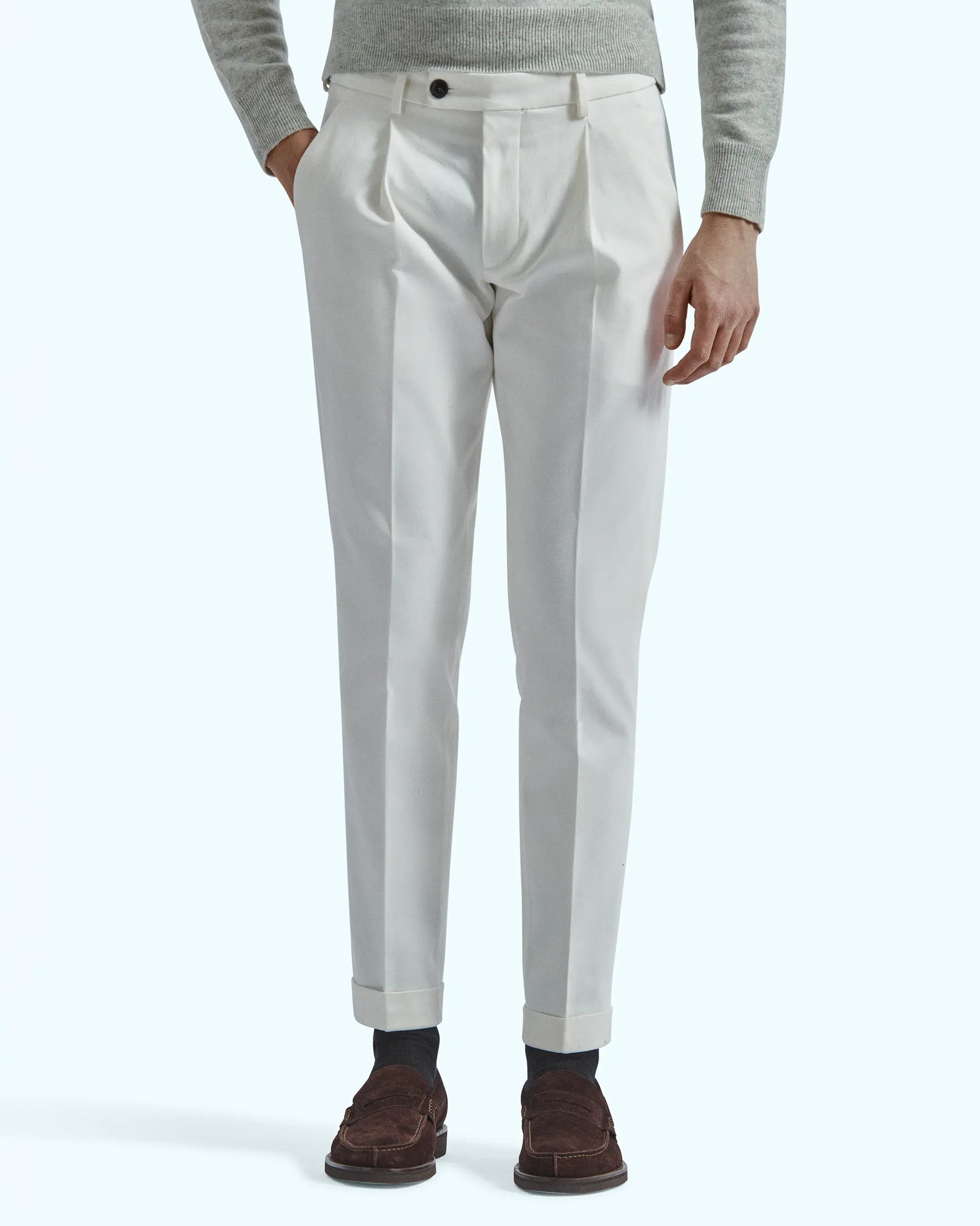 White trousers in stretch gabardine with pleats and side button placket